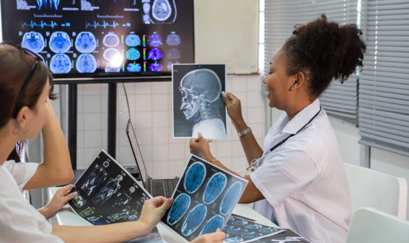 group of medical student study in class room. medical students studying human brain disease diagnosis through learning from X-ray film. Learn about brain surgery for diagnosis.