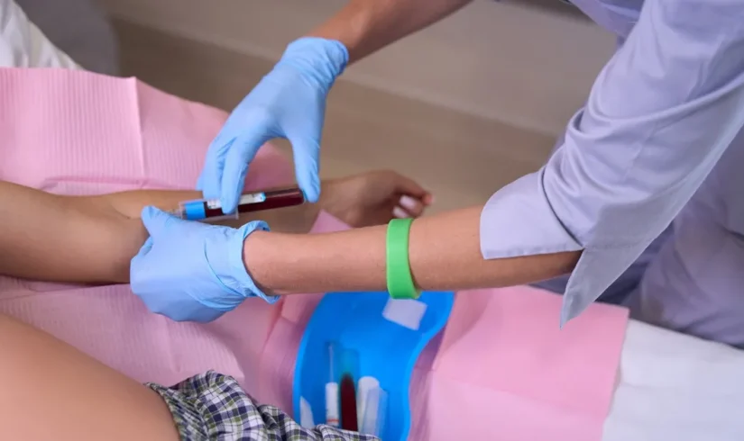 cropped-image-of-female-nurse-taking-blood-with-sy-2024-10-20-05-23-16-utc