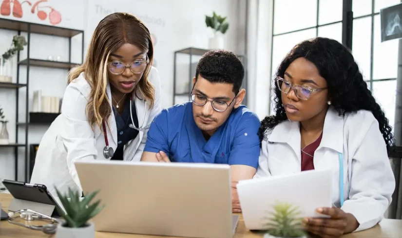 three-multiracial-doctors-having-conference-at-hos-2024-12-13-12-48-03-utc